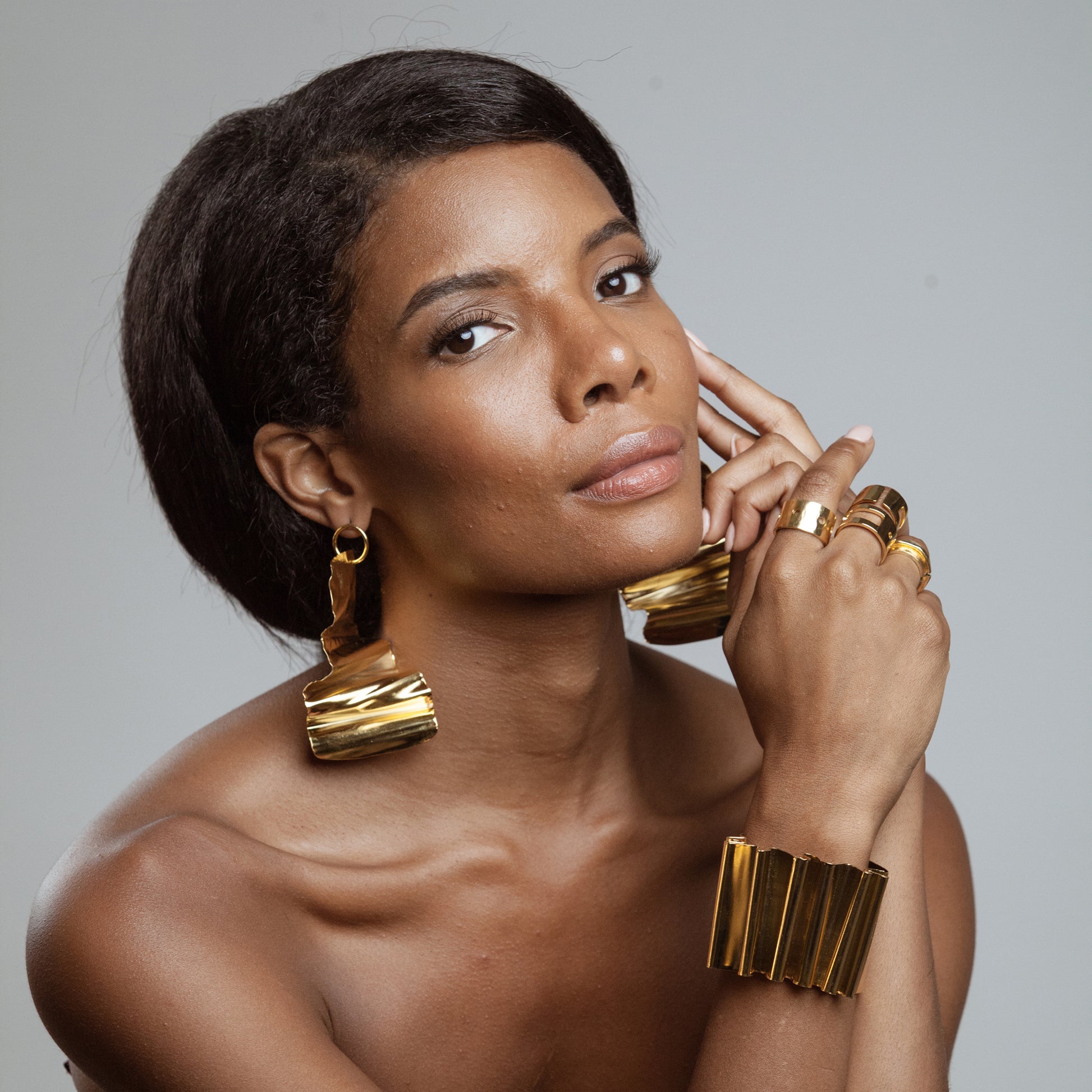 African American Model wearing Frida Bracelet Iza by Silvia D'Avila - Original Sophistcated Statement One of a Kind Jewelry Made in NYC - 14K Pleated Gold