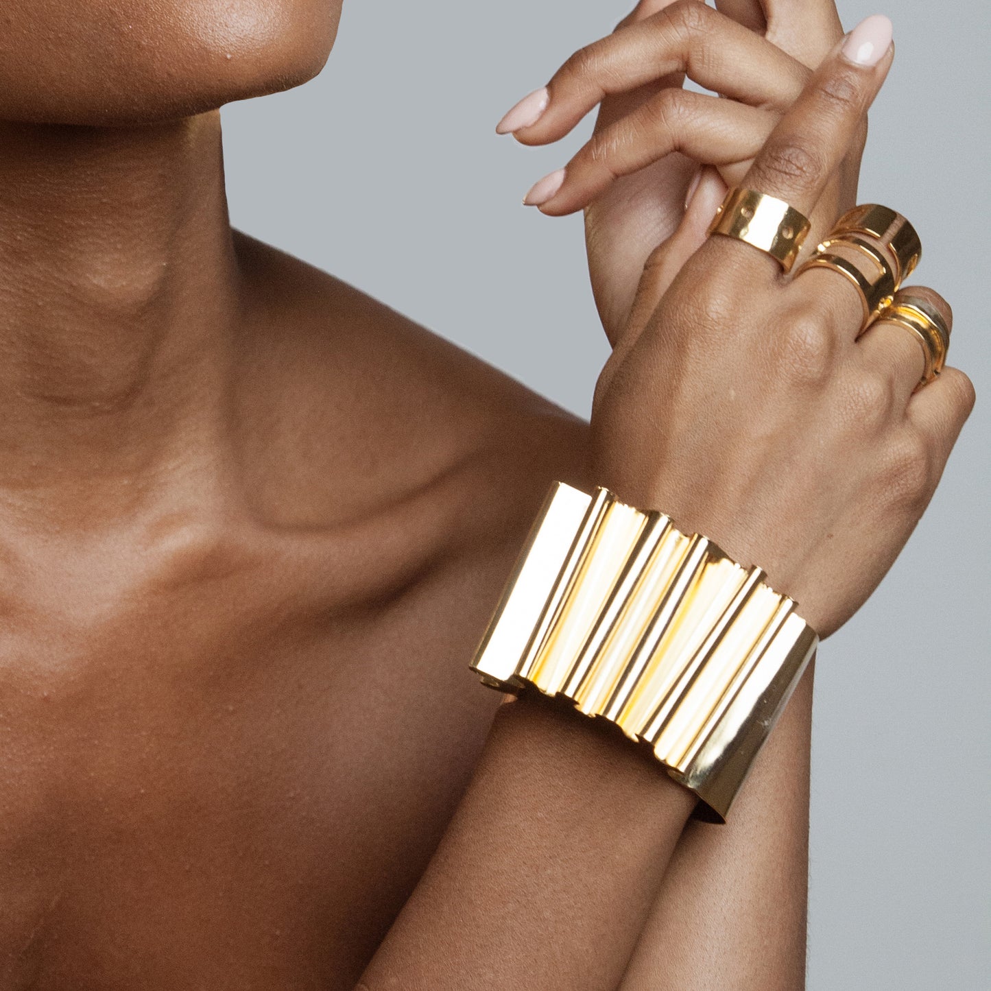 African American Model wearing Frida Bracelet Iza by Silvia D'Avila - Original Sophistcated Statement One of a Kind Jewelry Made in NYC - 14K Pleated Gold